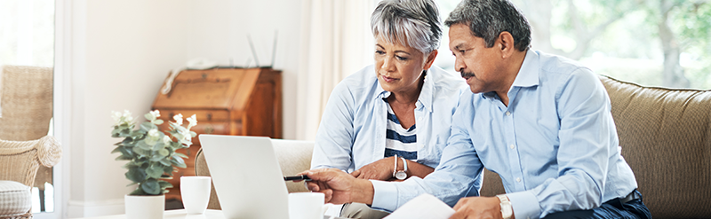 Couple on Laptop Researching Medicare Plans