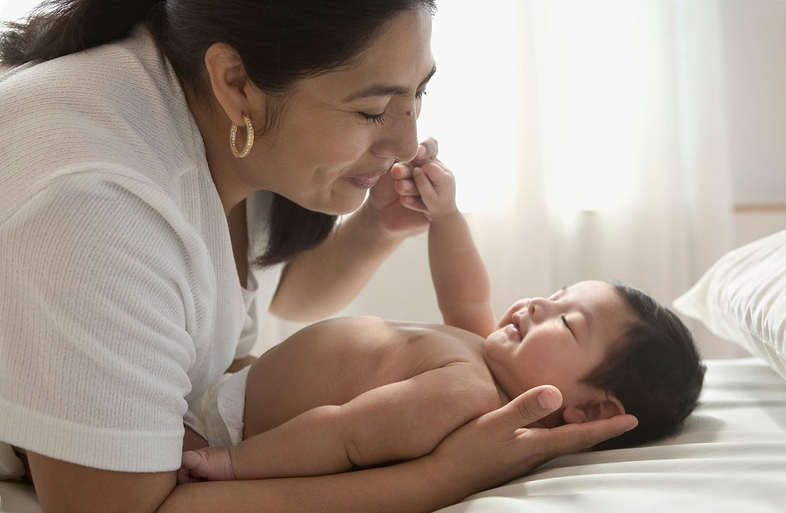 Smiling mother with baby