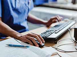 Provider working on a computer