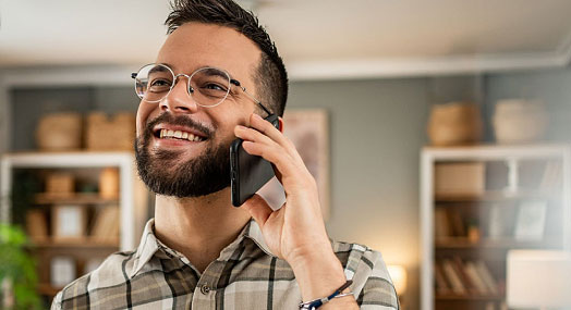 Smiling man on his phone